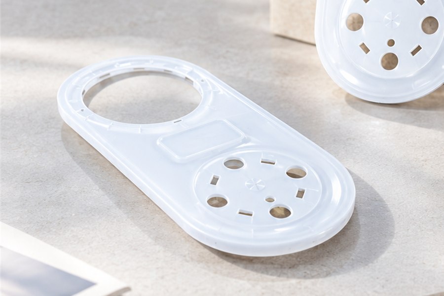 PC handheld therapy device top cover showing circular and rectangular hole positions
