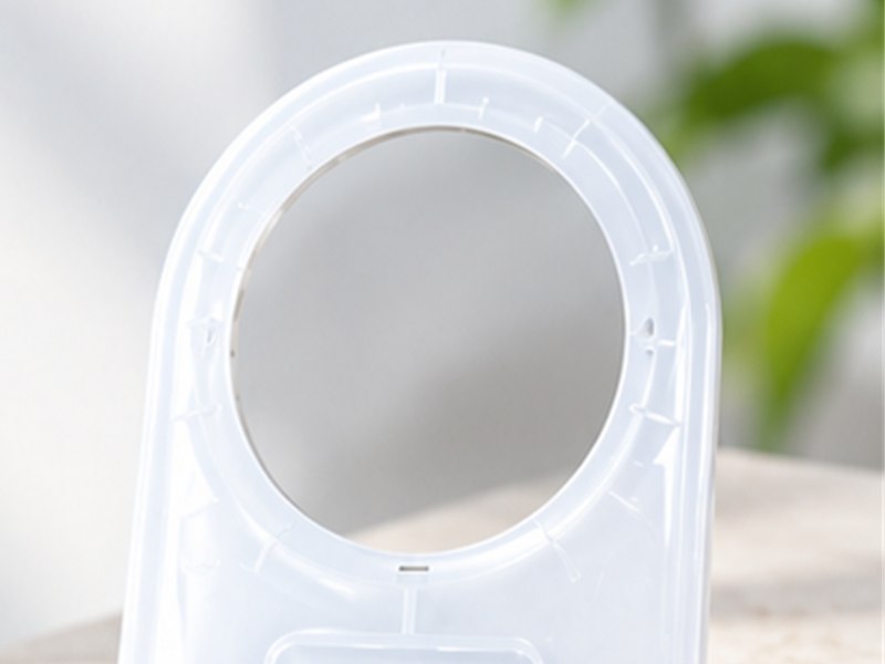 Close view of the main circular opening on a PC handheld therapy device top cover