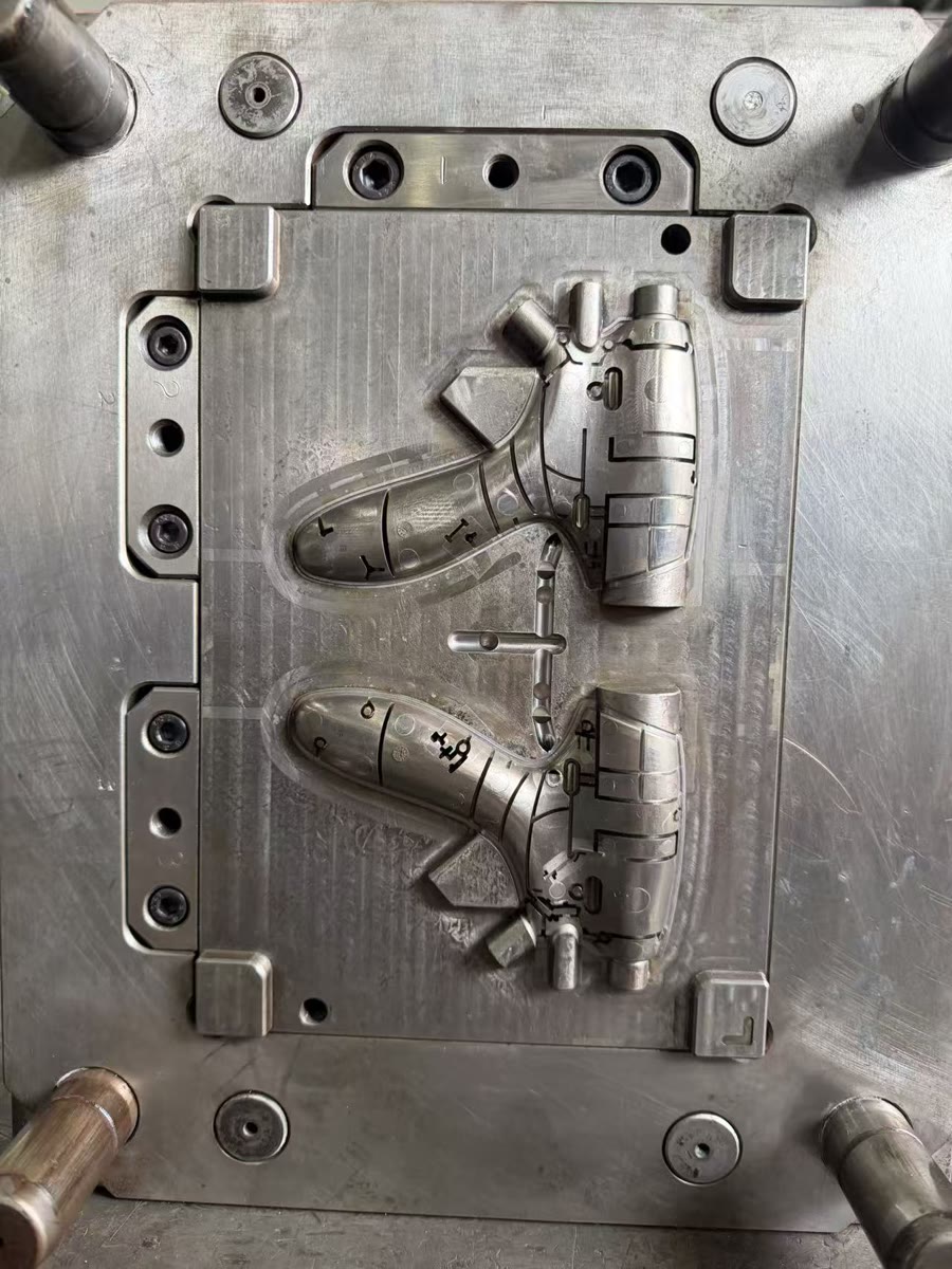 Core side of the custom injection mold showing the internal geometry of an ultrasonic handle shell